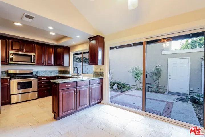 Kitchen with view of Enclosed Patio