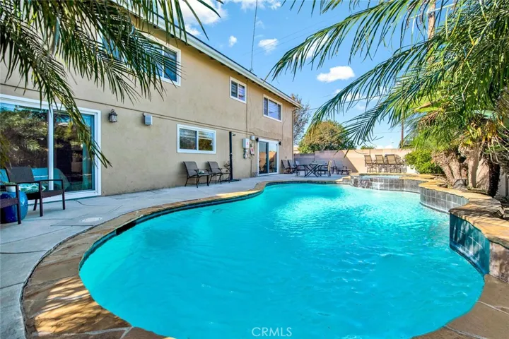 Entertainer's Dream Backyard with Sparkling Pool/Spa and block wall Fencing