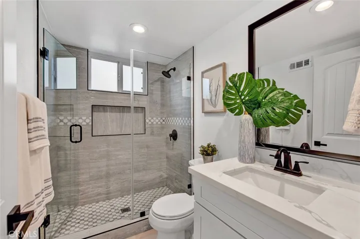 Completely Remolded Bathrooms with Quartz Countertops.