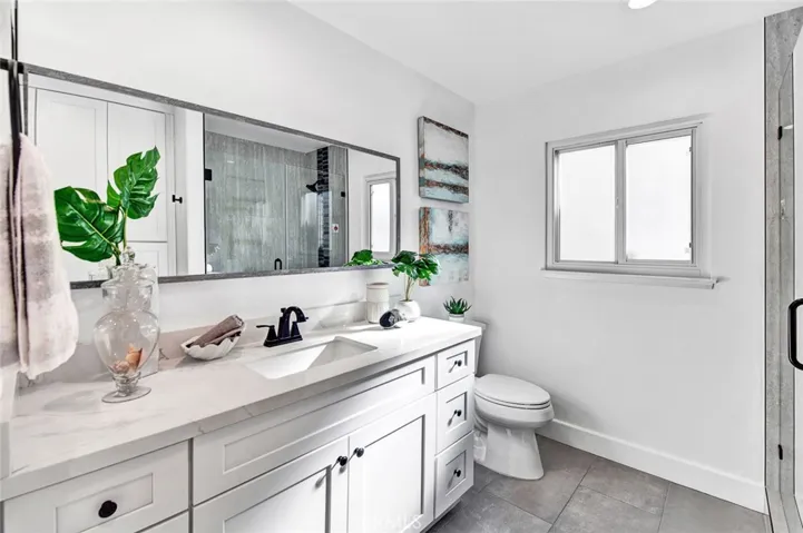 Completely Remolded Bathrooms with Quartz Countertops.