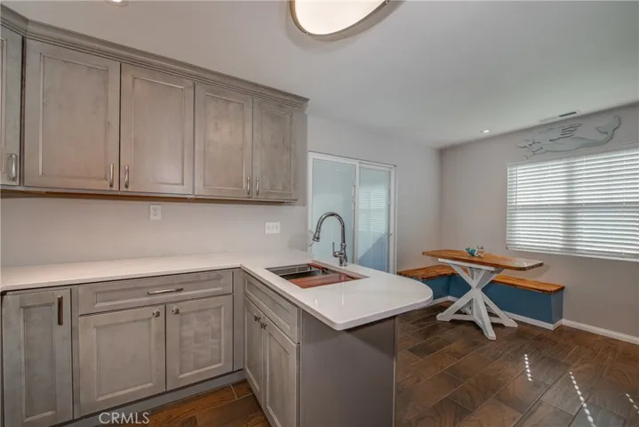 The custom butcher block table and benches fit the dining space perfectly.