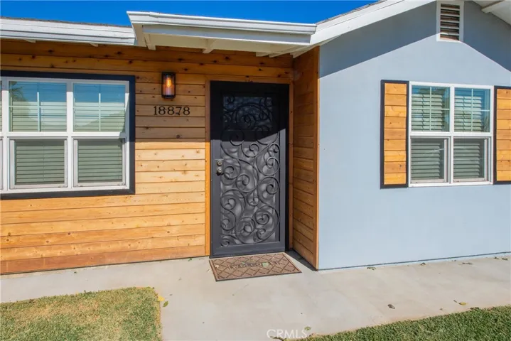 The pine wood slats welcome you to this charming home.