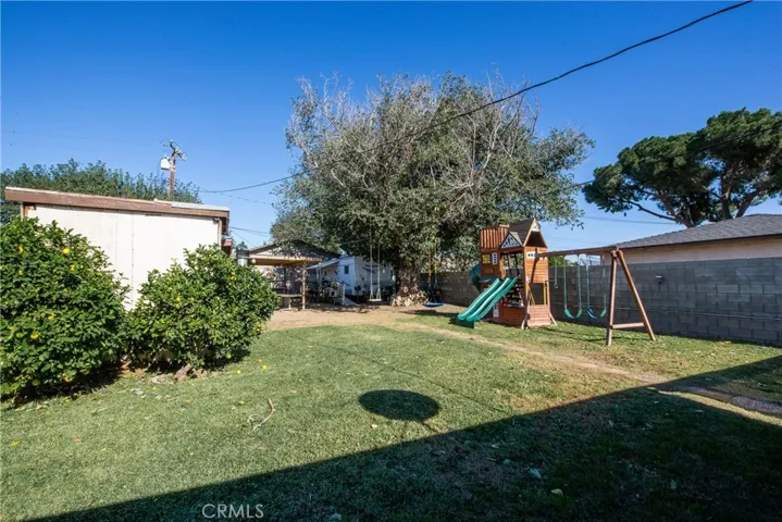 There is plenty of grass area in the backyard for all to enjoy.