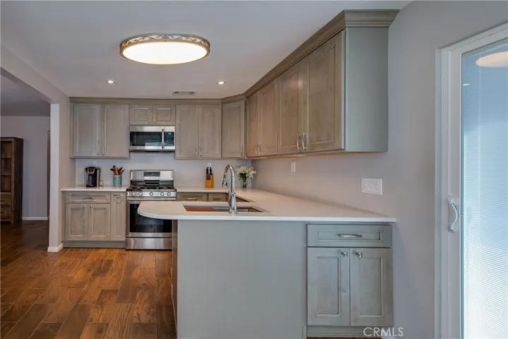 The deep stainless steel sink has a built in cutting board to make prepping effortless.