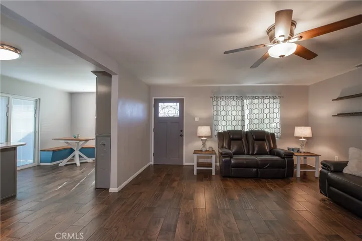 The living room is next to the kitchen.