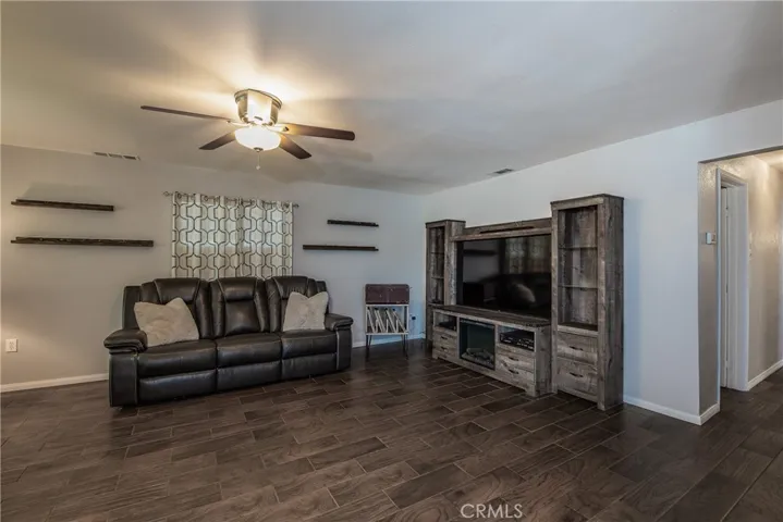 Stay cool in the living room with the large ceiling fan.