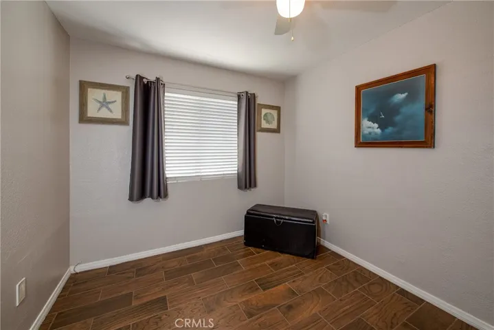 Bedroom 3 has a ceiling fan and large window to keep the natural light flowing.