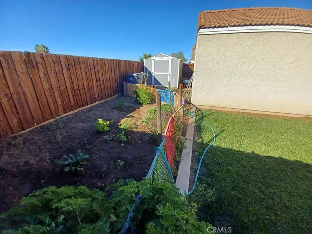 Even more rear yard with garden area and oversized shed included. Nice newer fencing.