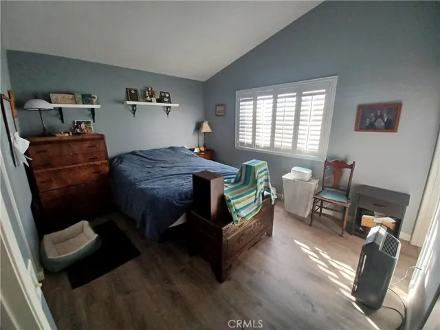 Good sized master bedroom w/ shutters.