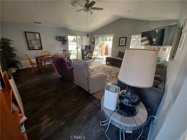Another great room view from hallway to front and sliding door to sideyard.