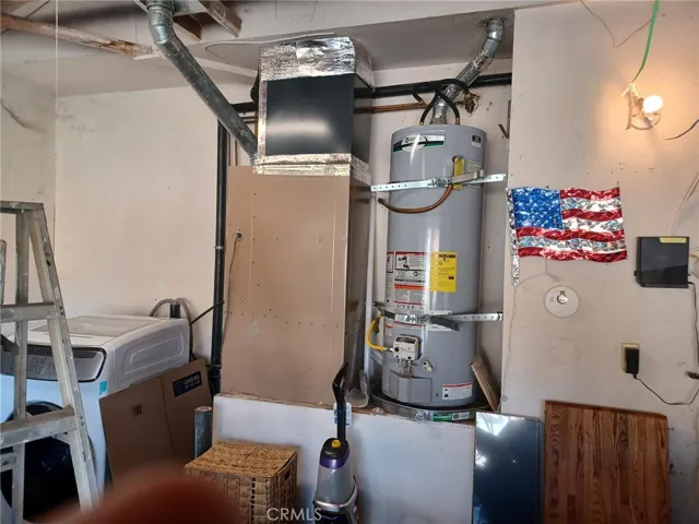 Newer HVAC system, water heater. Washer and dryer to the left that was relocated from the pantry.