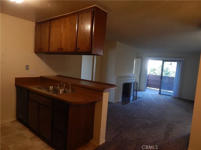 Kitchen looking into living room