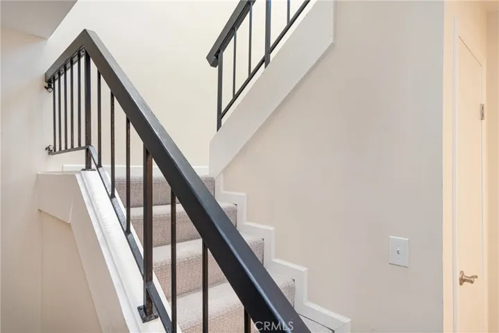 Stairs to bedrooms and full bath