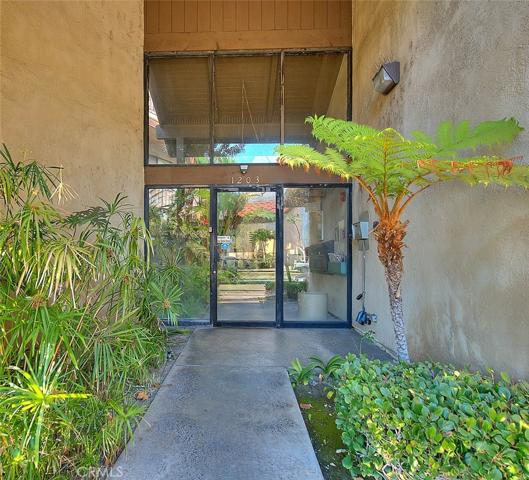 Walk-up entryway (autos enter on end of building with remote)