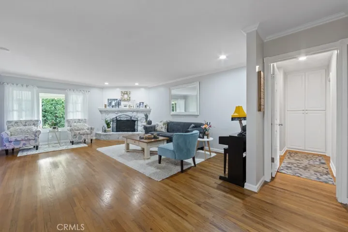 Gleaming original hardwood floors and fantastic highlighted fireplace