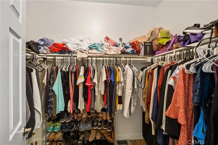 Primary bedroom walk in closet.