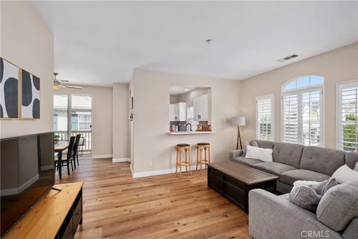 Luxury vinyl plant flooring flows throughout the home.  Dine at the bar or in the adjacent dining room.