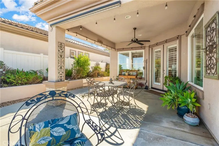 Covered Patio with Roll-up Sun Shade and Ceiling Fan