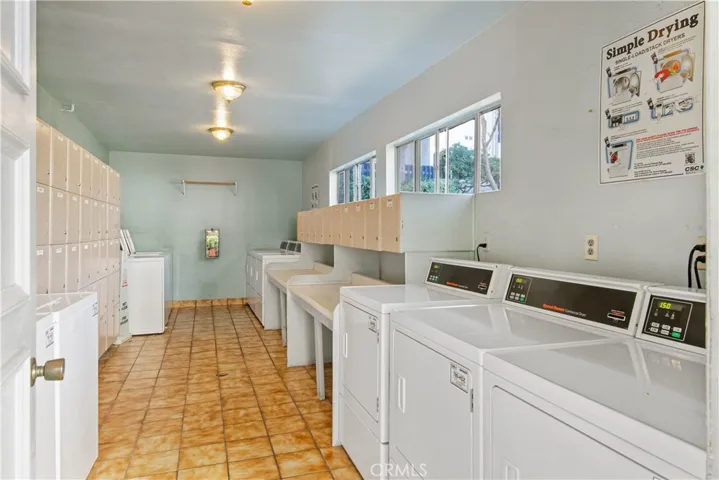 Community laundry room w/private storage cabinet