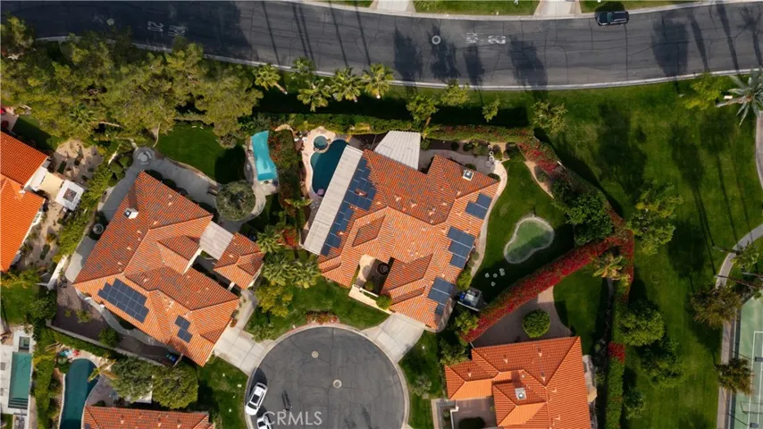 The home sits at the end of the cul de sac and gives good separation and privacy from the neighbors. The road behind the home is San Marino Circle, which is inside the community.