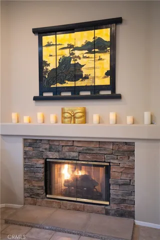 A close up view of the fireplace in the family room
