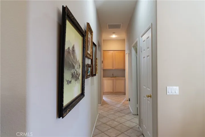 At the end of the hall way to the front 2 bedrooms, there's lot of storage in the cabinets