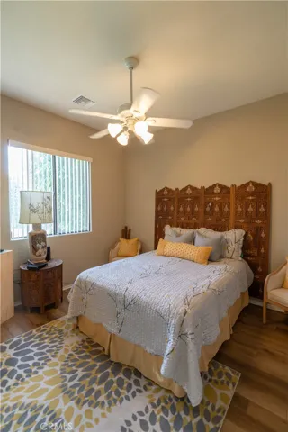 This is the front bedroom and it also has the view of the grass yard and the putting green