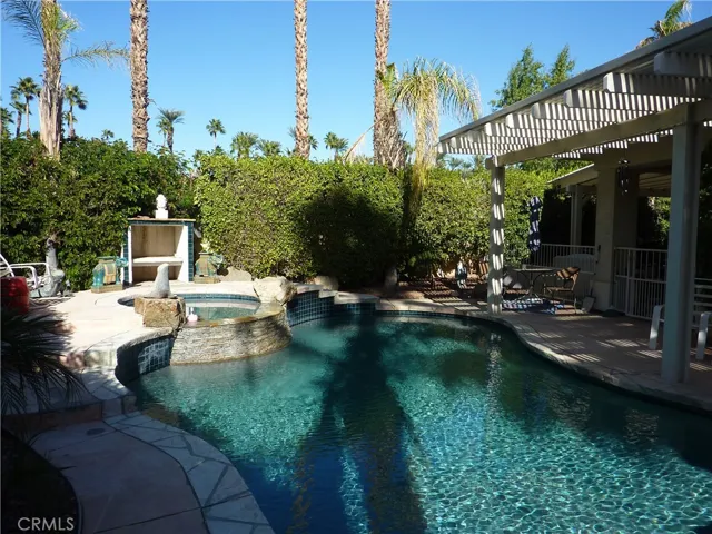 Lots of patio area around the pool and some of it is covered. Fully landscaped around the pool too for extra privacy.
