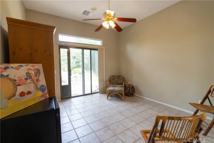 The back third bedroom has a sliding glass door that opens up to another part of the rear patio