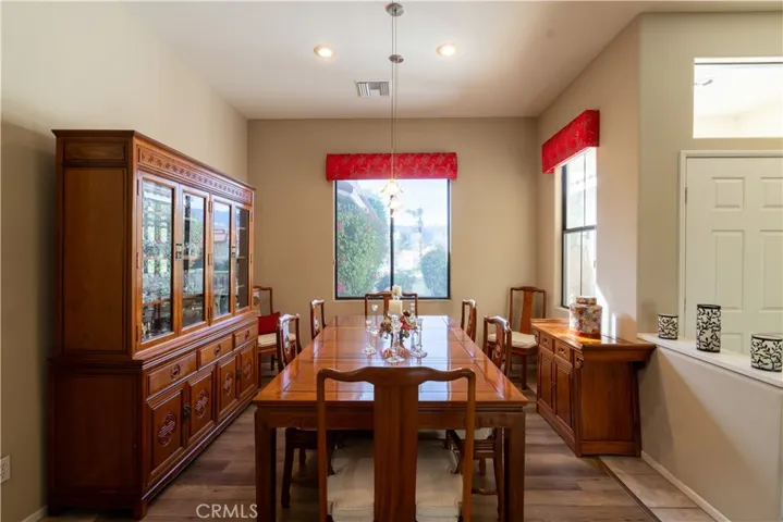 The formal dining area is just off the kitchen near the front door