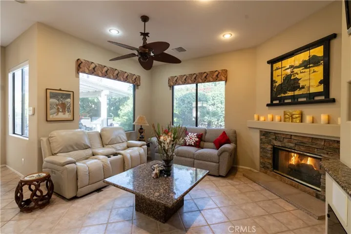The family room is the perfect place for watching tv with the fireplace going