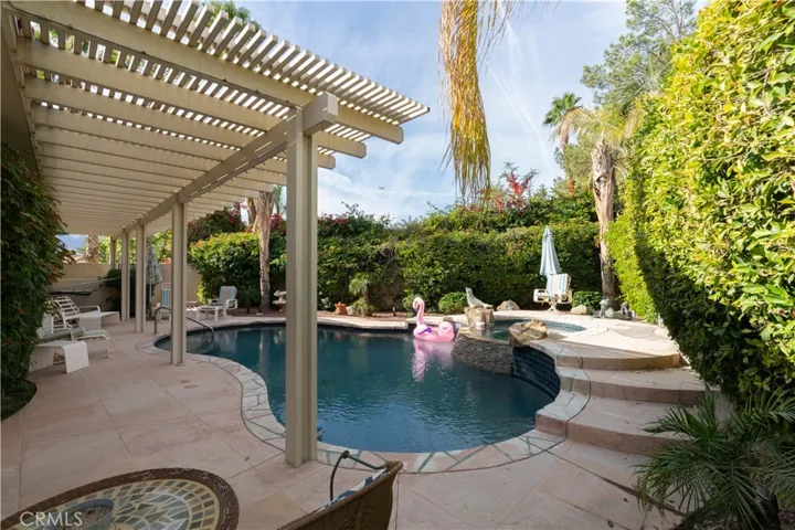 The freeform pool and hot tub are just outside the master suite