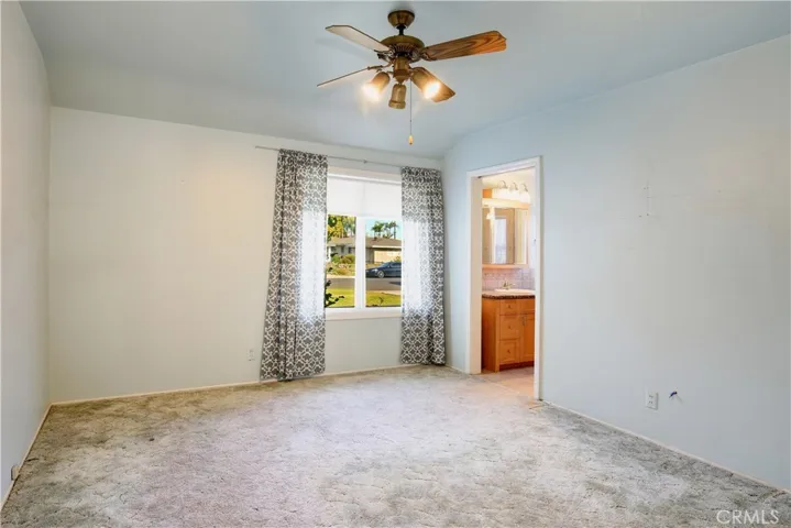 Primary bedroom with adjoining bathroom.