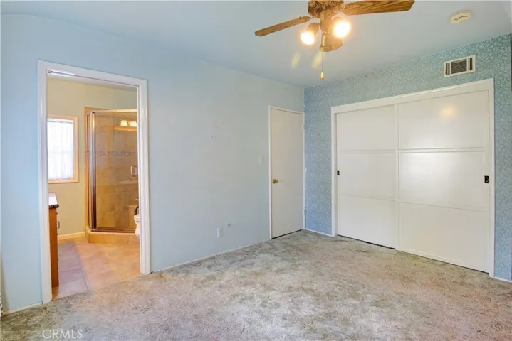 Primary bedroom with adjoining bathroom.