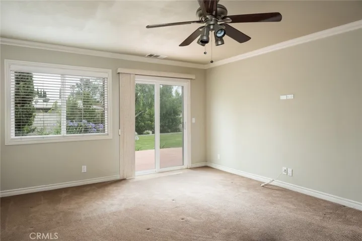 Master bedroom with en suite and backyard patio deck.