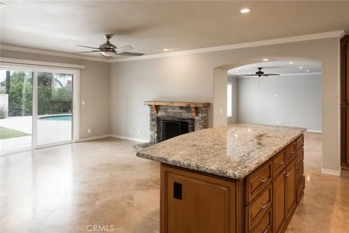 Living room with fireplace and kitchen island.