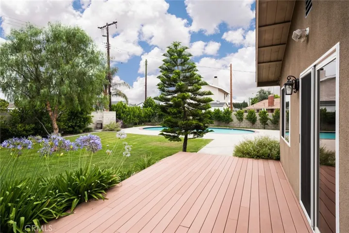 Spacious backyard with deck.