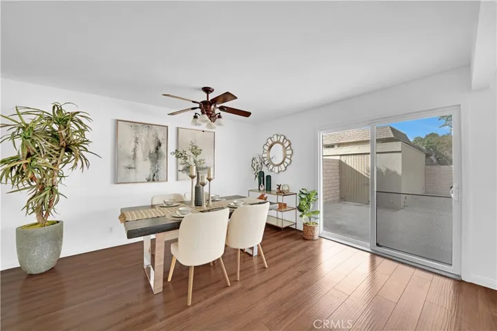 Full-Size Formal Dining Room with Ceiling Light Fan and Sliders that Open to Extra Large Private Patio