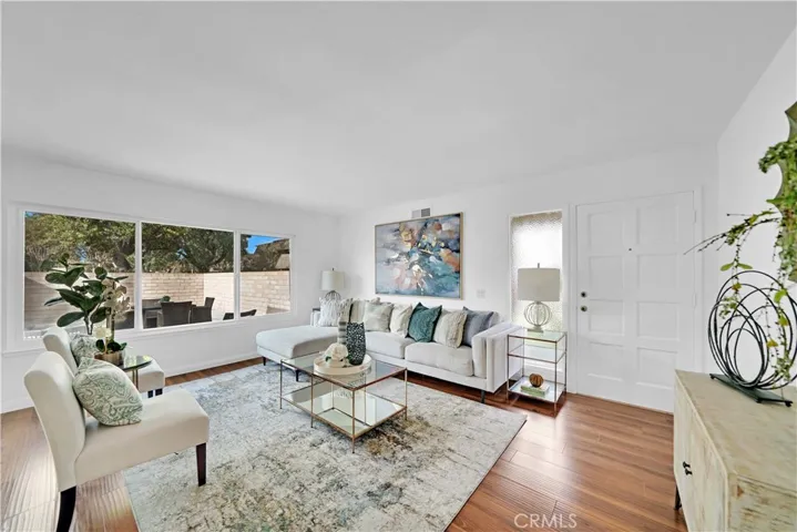 Lovely Living Room with Wood Laminate Flooring, Dual Pane Windows, Smooth Ceiling