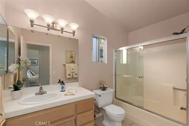 Secondary bath is private, yet with a window to let the breezes through