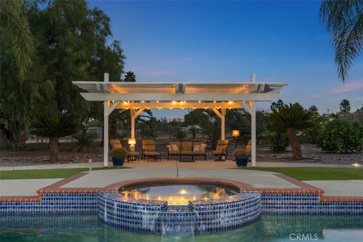 Custom-made pergola strung tastefully with lights