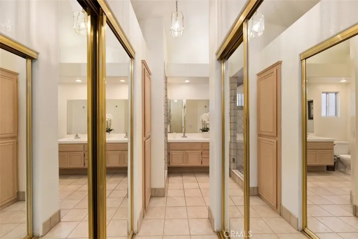 There is ample closet space tucked in the vestibule between primary bedroom & bathroom