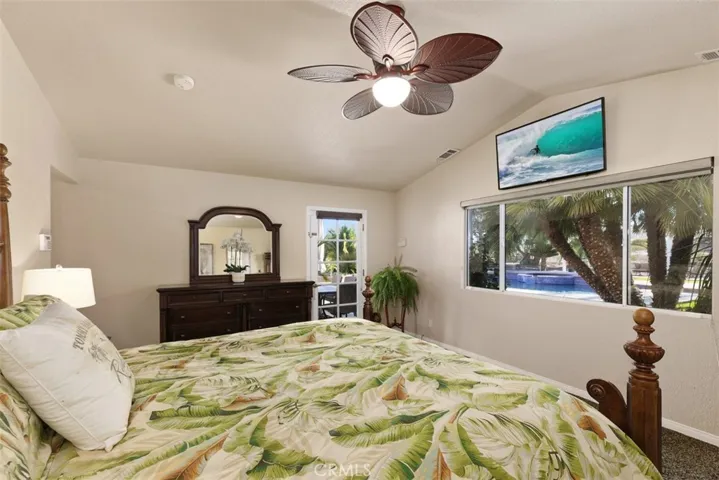 Primary bedroom has direct access to that amazing yard through a french door