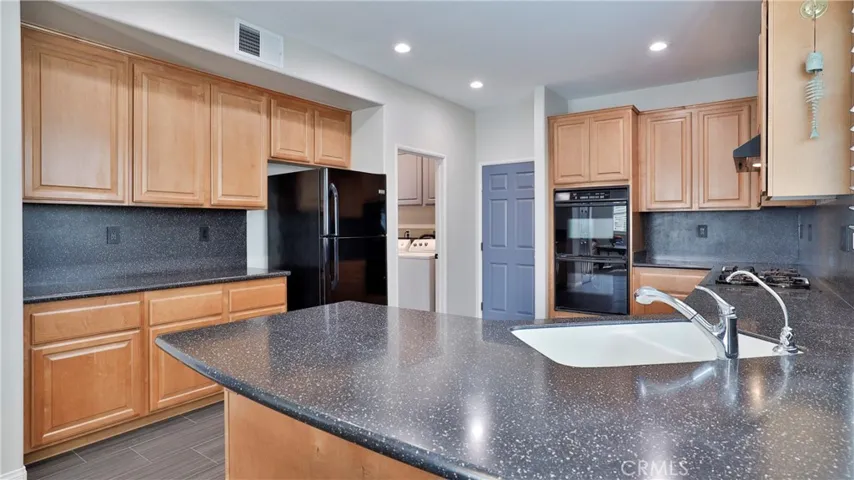 Love to cook?!  Double ovens are perfect for cooking at different temperatures.  Generous counter space, pull out pots and pans drawers, Inst Hot water and a water filtration system are bonuses many homes just don't have.  With the laundry room adjacent, multi-task by doing laundry and dishes at the same time (lol!).  And with laundry downstairs, you can get a head start on the day's chores without waking everyone up!