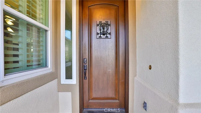 This beautiful front door has a door viewer (for those pajama mornings.)