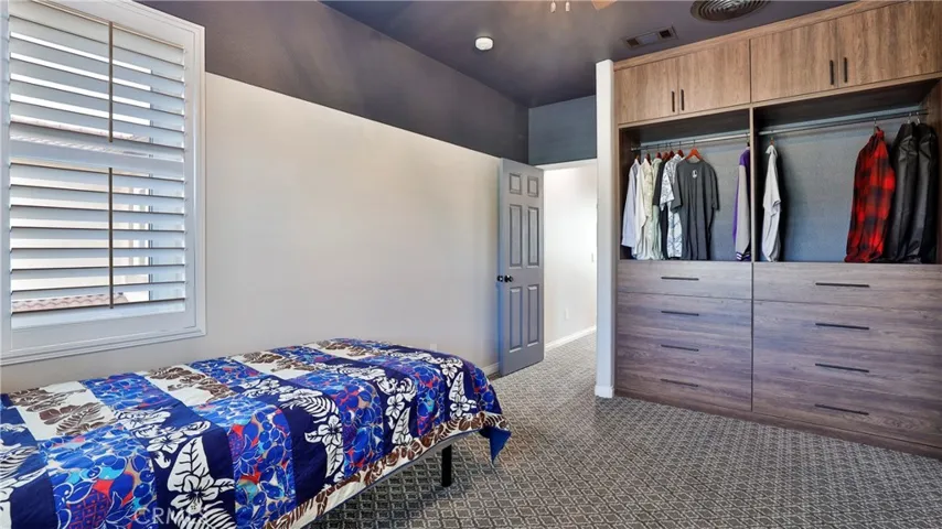 The custom closet has storage for all your clothes.