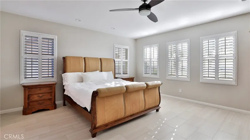 The spacious primary bedroom still has room to roam with a king sized bed in place.