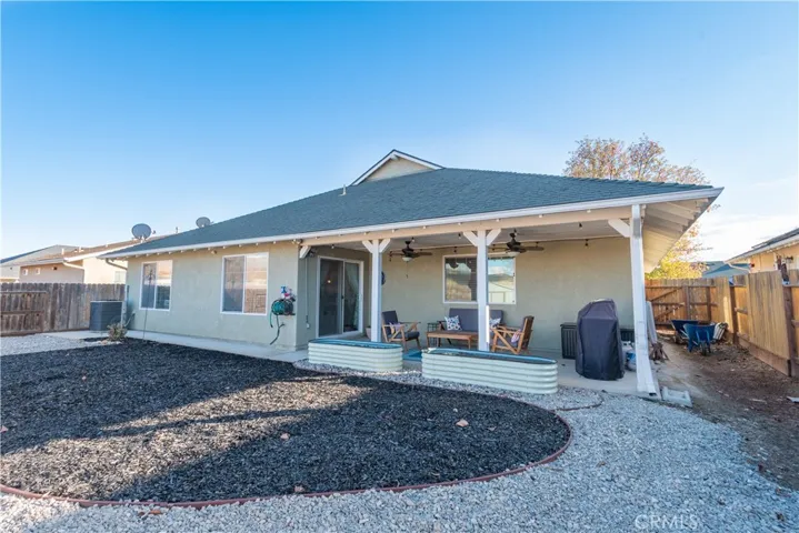 Back of 635 Benedict showing the spacious patio with ceiling fans