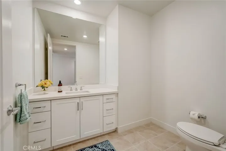 A hall half bath for guests.