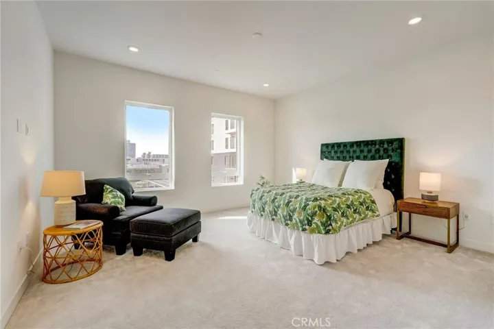 The spacious primary suite is filled with natural light and is the perfect retreat.